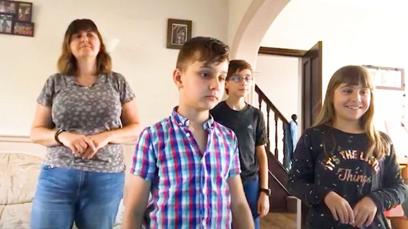 Children accompanying a worship song with actions