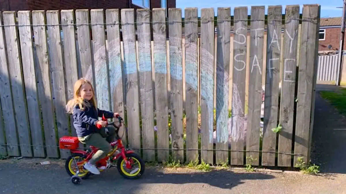 Young girl cycling on a red bike