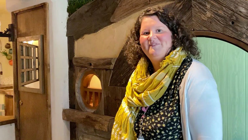 Smiling lady welcomes children to WOW Kids